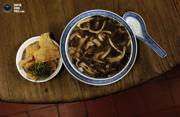 Snake meat is seen in a bowl of snake soup served at a snake soup shop in Hong Kong